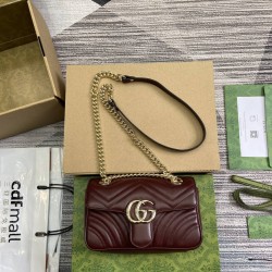 Gucci GG Marmont mini shoulder backpack with light gold color accessories and ivory white leather lining